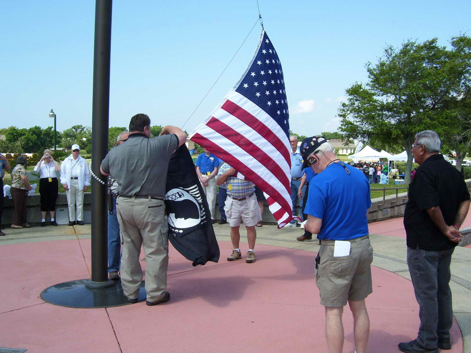 Raising the Charles P. Cecil flag over Veterans Memorial Park