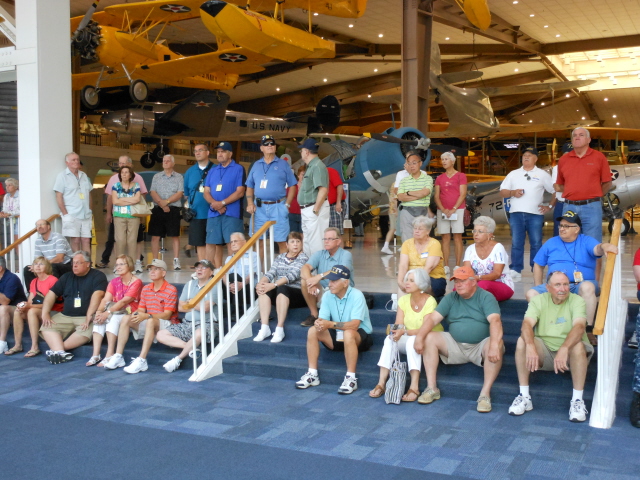 Tour guide Ardell Johnson briefing VF-103 in the Atrium of the National Naval Aviation Museum